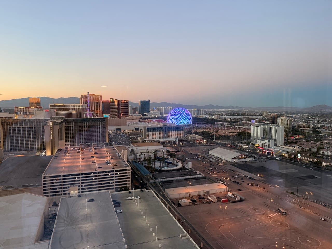 Sunset view from Elara with the Sphere glowing over Las Vegas