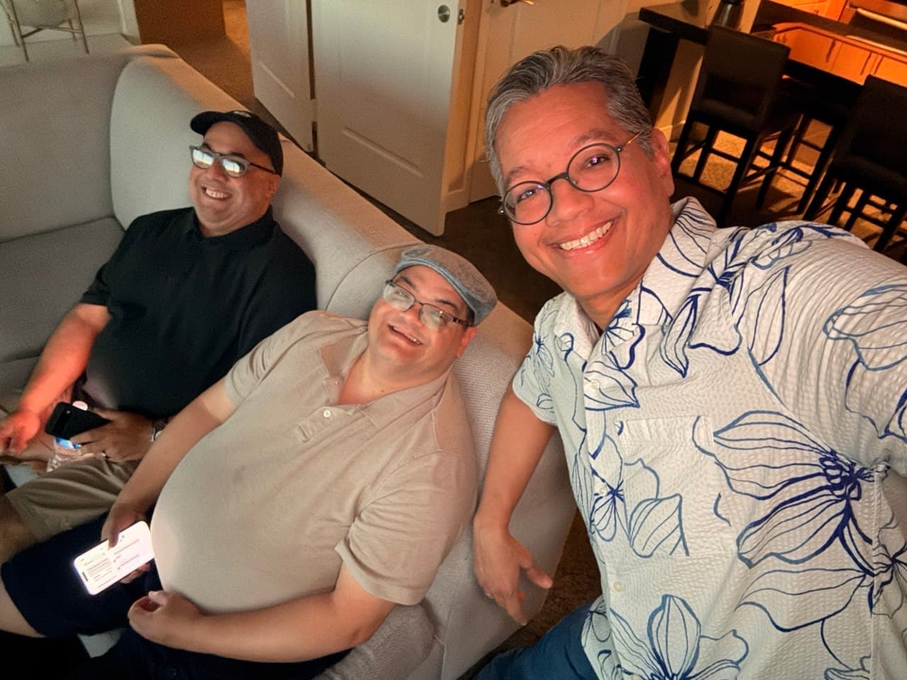 Gardy, Alejo, and Richie taking a break on the suite sofa before going out