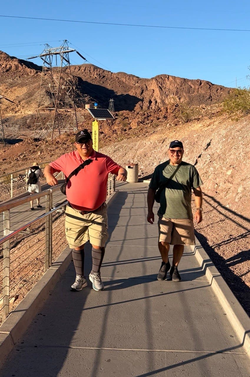 Alejo and Gardy walking across Hoover Dam