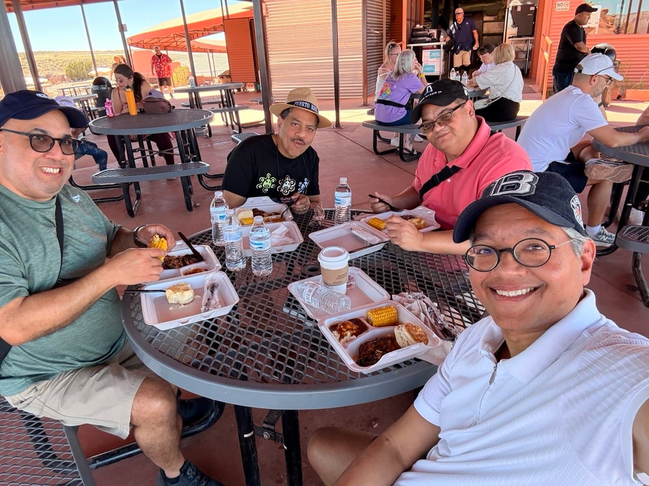 The four friends having barbecue lunch at the Grand Canyon