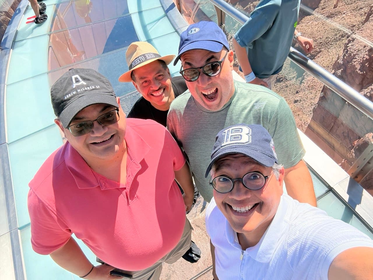 The four friends with scared faces on the Skywalk glass floor