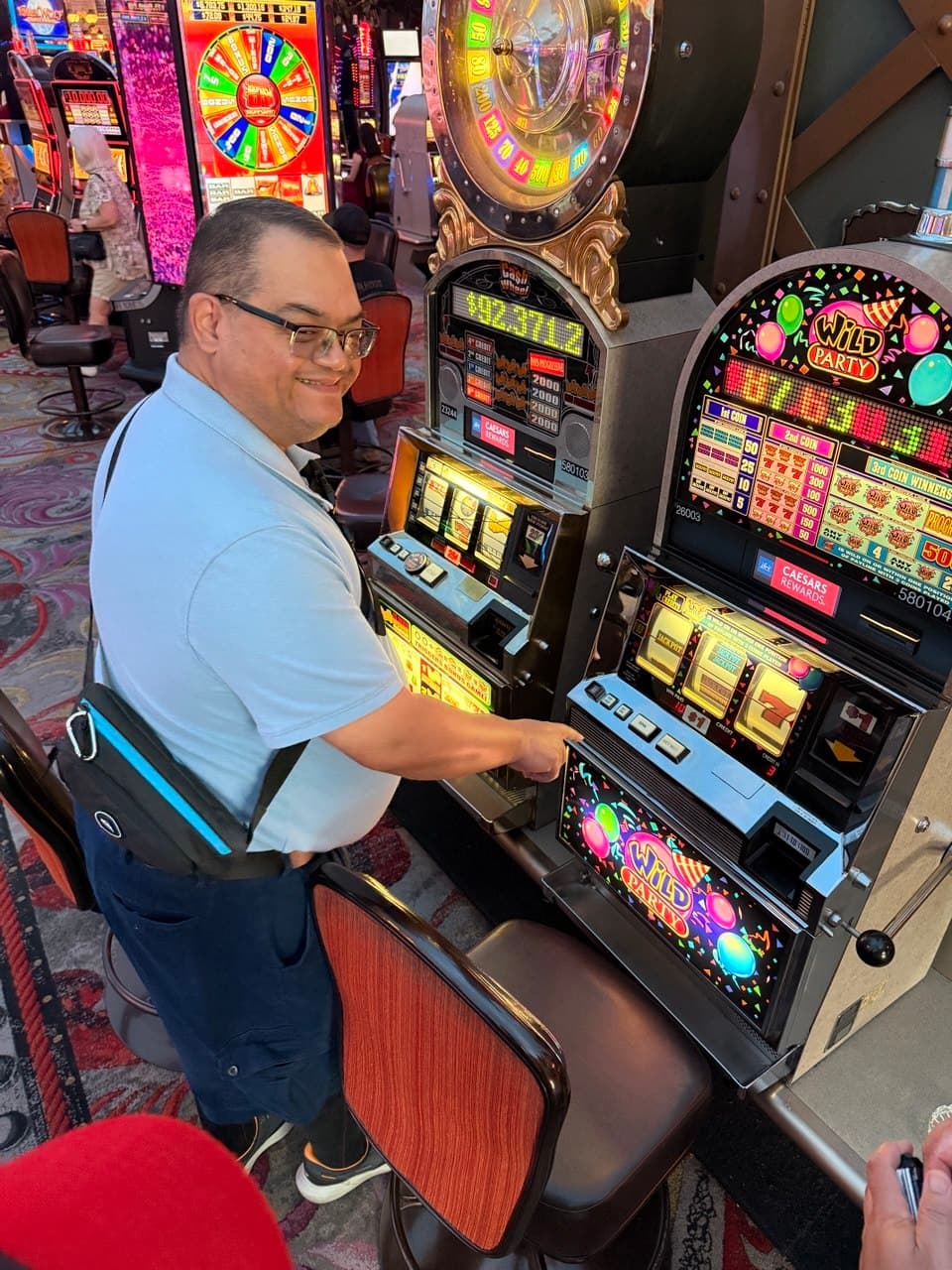 Alejo at the Wild Party slot machine in the casino