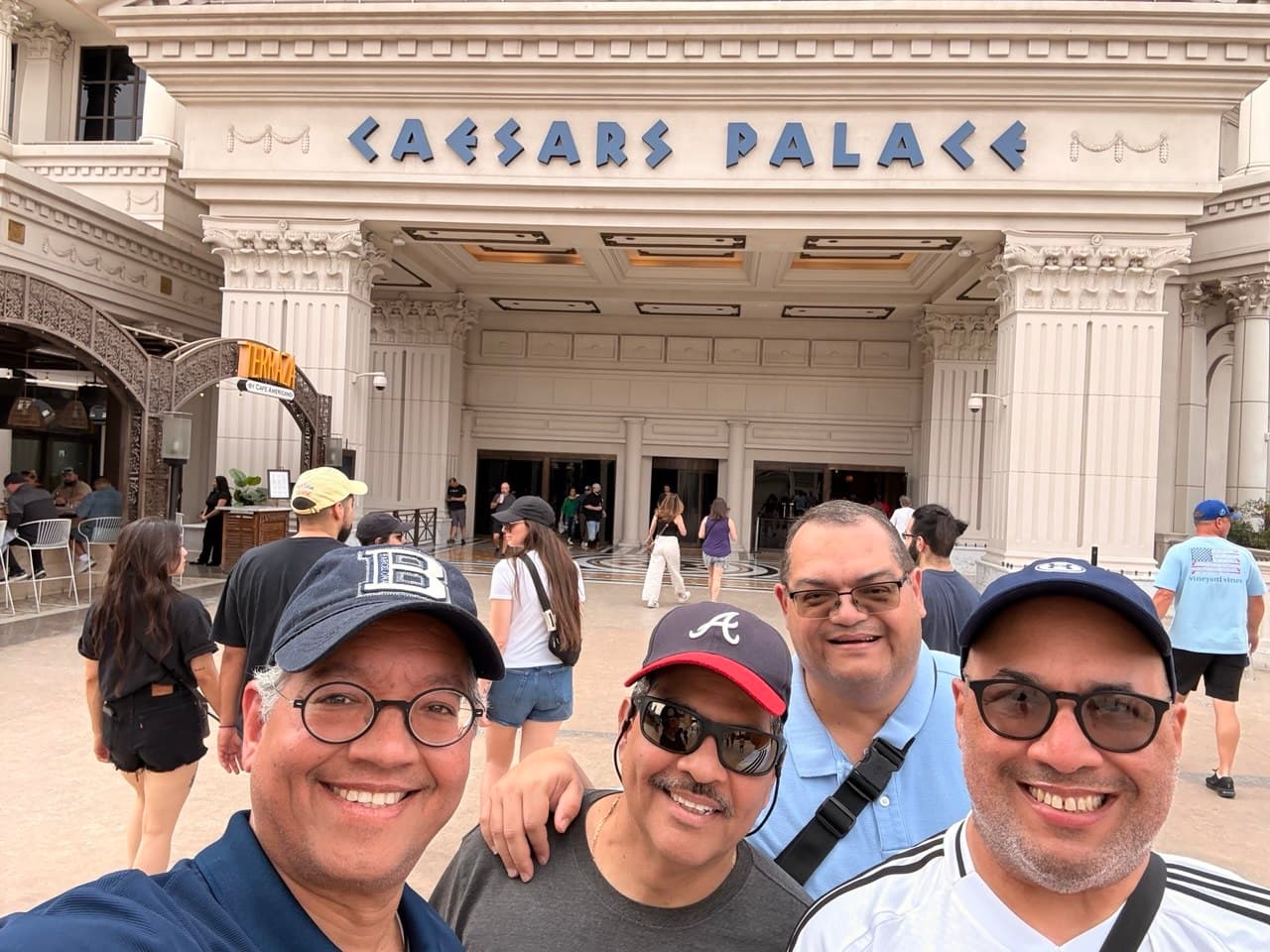 The four friends at the Caesars Palace entrance